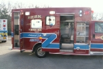right side view with open compartments and entrance to rear cargo area
