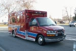 shiny ambulance outside, the name \"Berkley\" displayed prominently above the windshield
