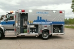 left side view of truck with open compartments