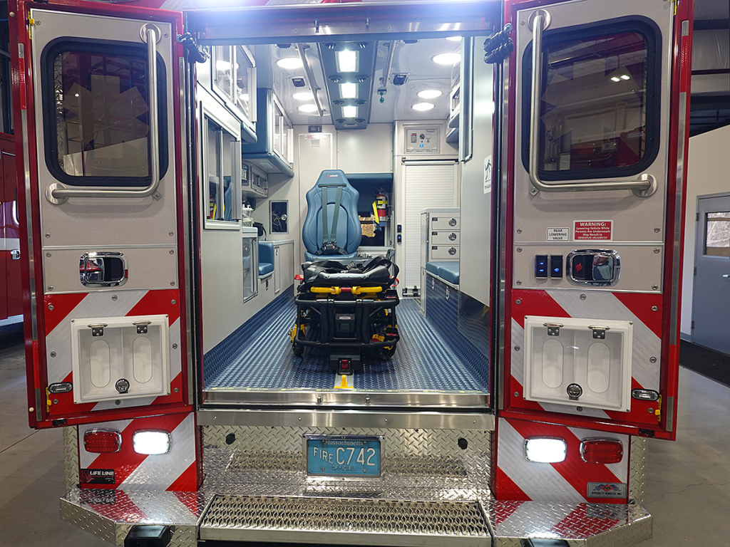 View the patient care area through the open back doors.