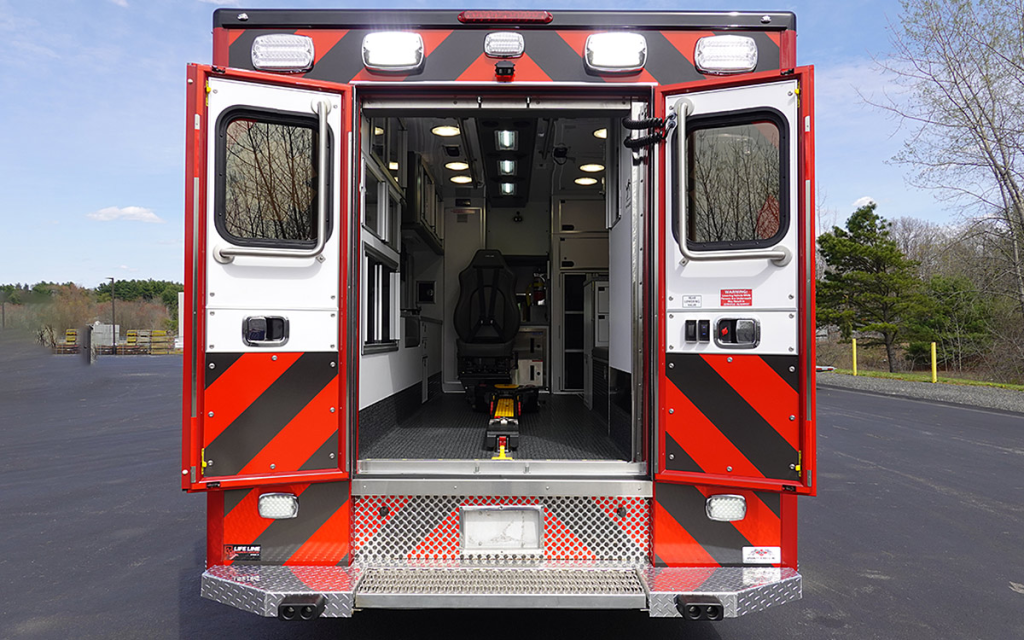 The back doors are open to the patient care area.