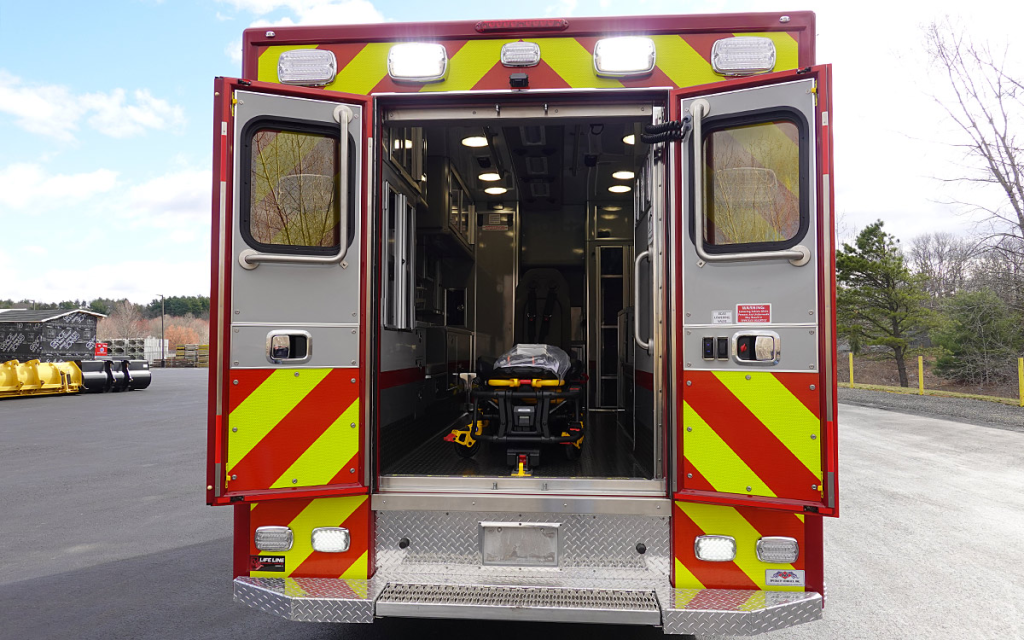 The back doors are open to the patient care area.