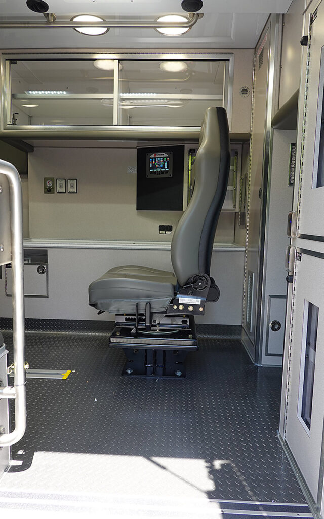 A side door to the patient care area on the passenger side of the ambulance.