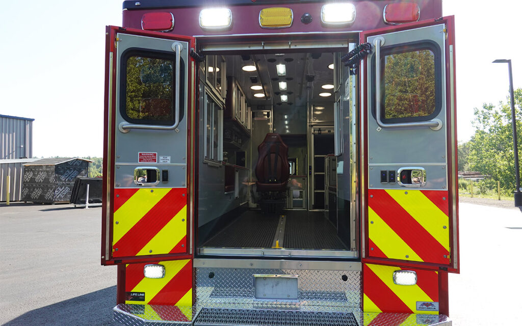 The back doors are open to the patient care area.