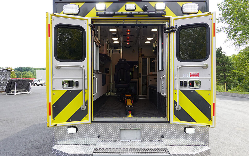 The back doors are open to the patient care area.