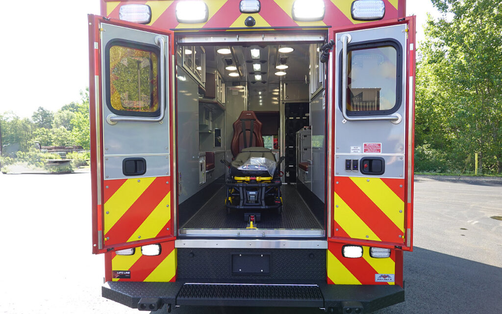 The back doors are open to the patient care area.