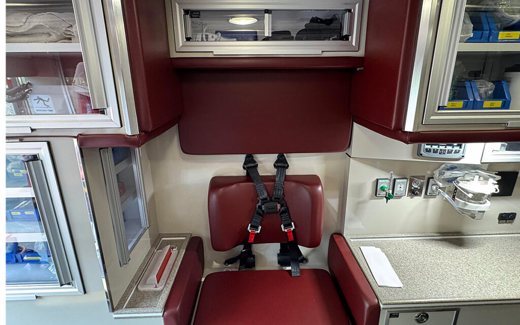 Cabinets and chair in patient care area.